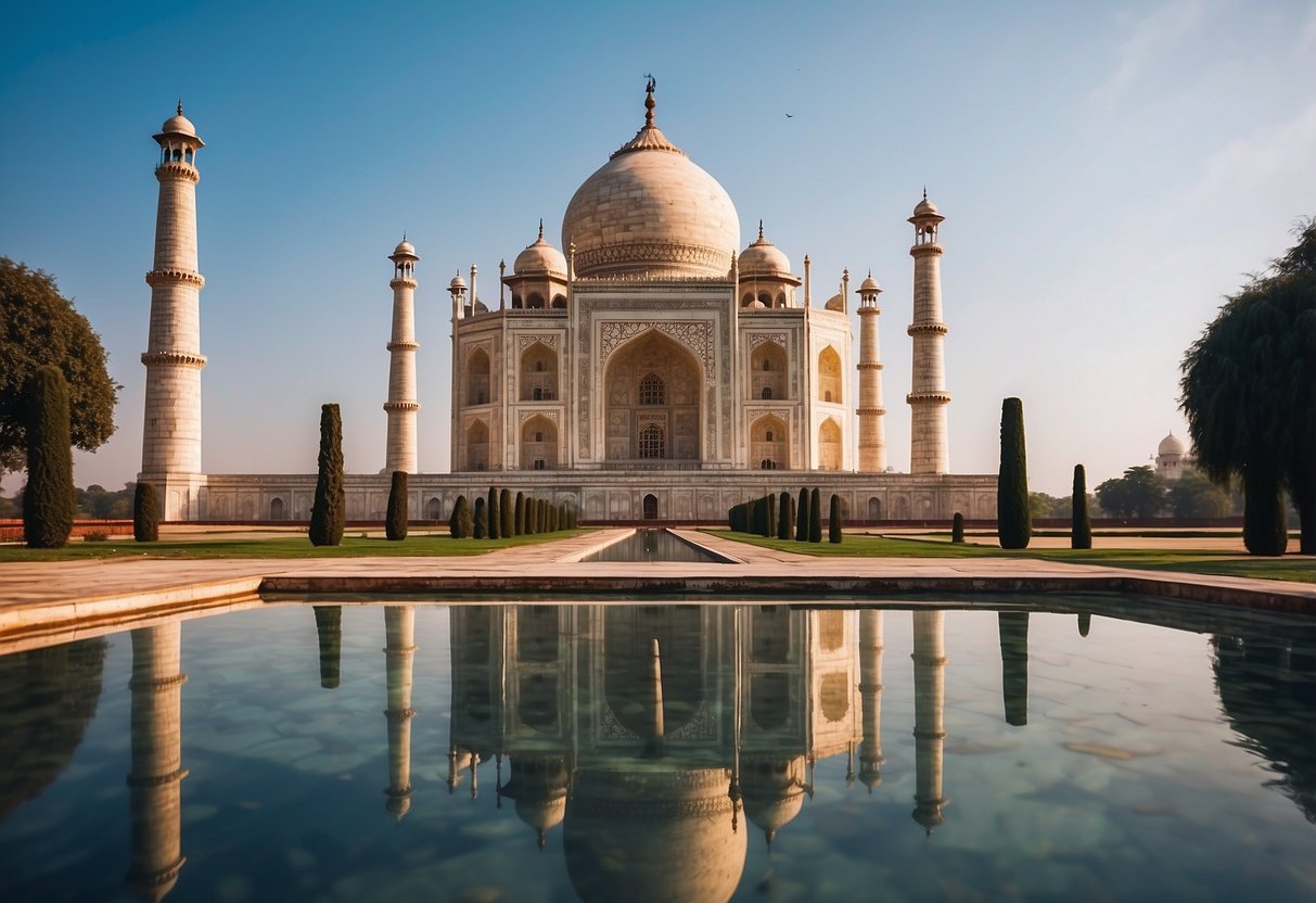 The Taj Mahal stands majestically against the backdrop of a clear blue sky, its pristine white marble reflecting the warm sunlight. Surrounding gardens and intricate architectural details add to the grandeur of this iconic symbol of love and history